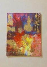 A multi colored yellow blue and red abstract painting
