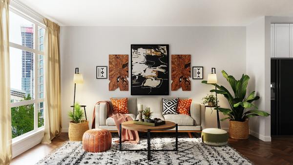 A photo of a living room with some art paintings on the wall