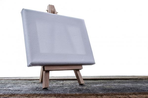 An isolated painting canvas placed on a stand